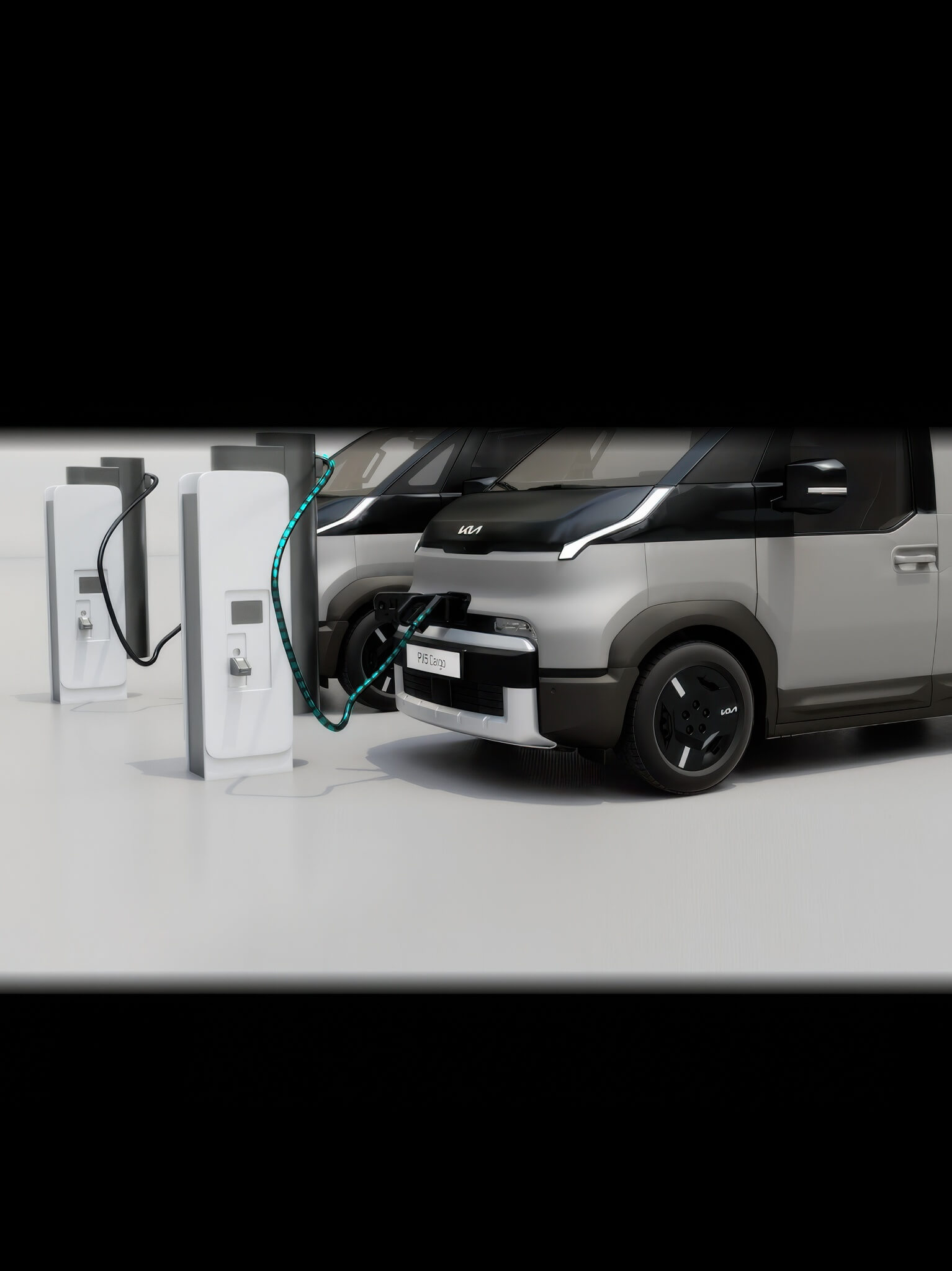 Close-up of the Kia PV5 Passenger front charging port with cable connected